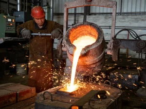 molten brass pouring process demonstrating high temperature melting point in foundry