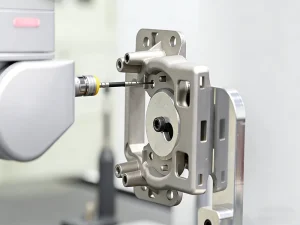 Quality inspection of a CNC machined metal part using precision measuring tools