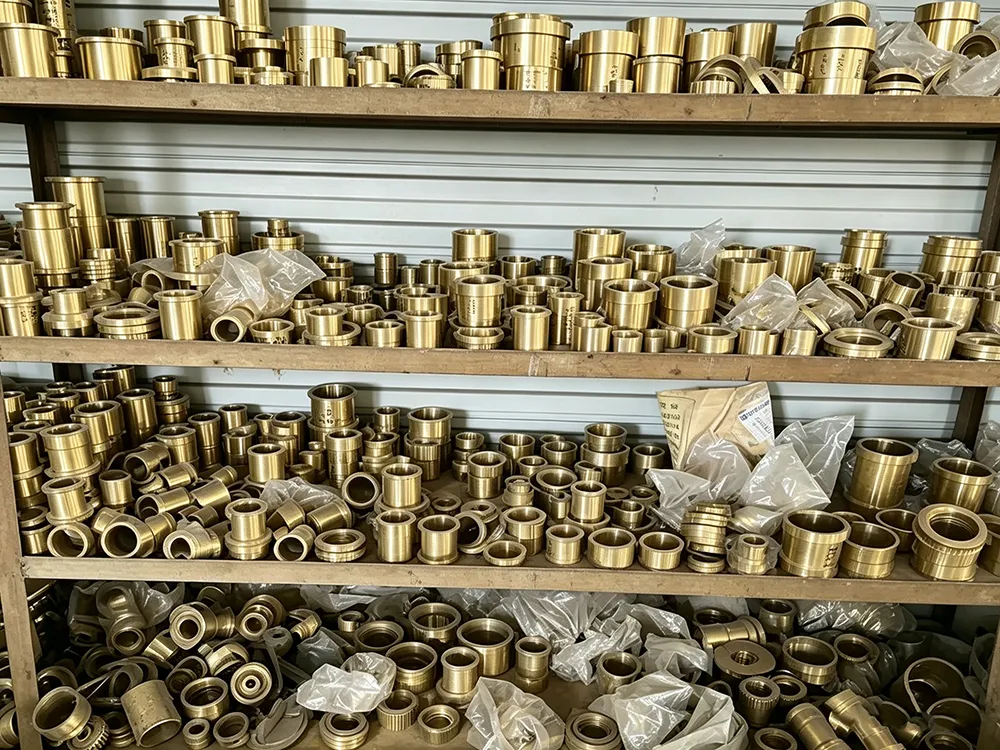 Brass vs Bronze vs Copper machined parts showing different metal components in workshop storage