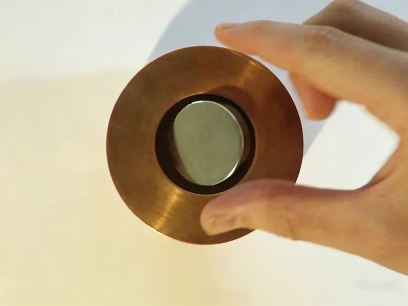 Copper ring and magnet demonstration showing magnetic interaction test