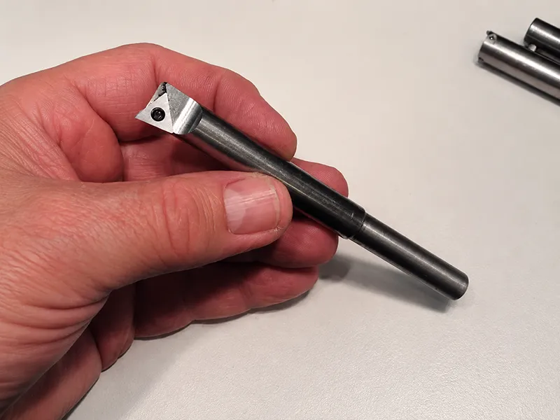 Boring bar cutting tool with indexable insert for internal turning and chamfering