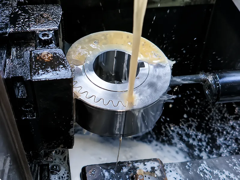 Close-up of CNC EDM machine cutting metal with precision