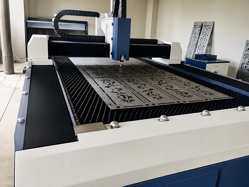Laser cutting machine engraving detailed patterns on metal plate