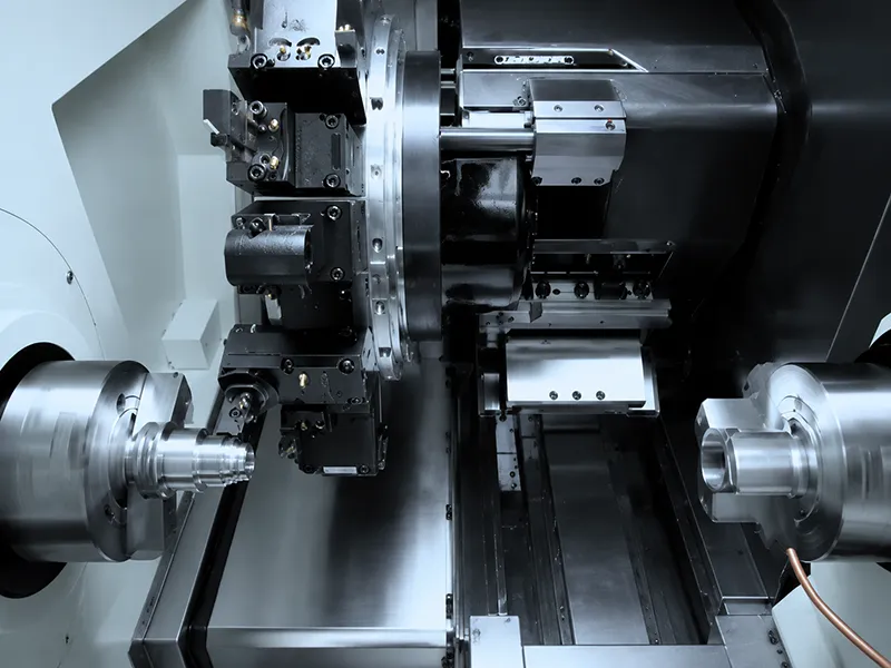 Interior view of CNC lathe with dual spindles and tools