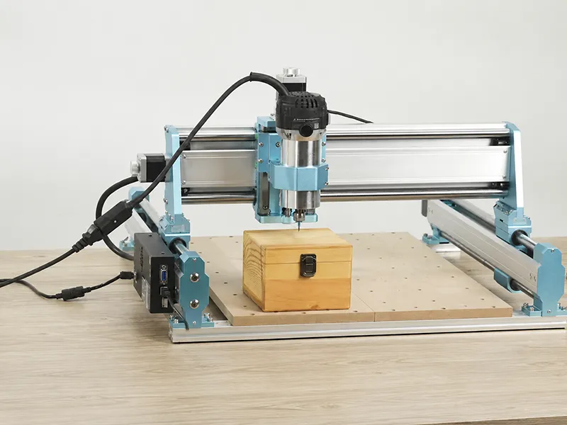 Compact CNC router cutting a wooden workpiece precisely