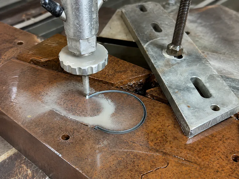 Swiss-type CNC lathe turning small cylindrical metal components
