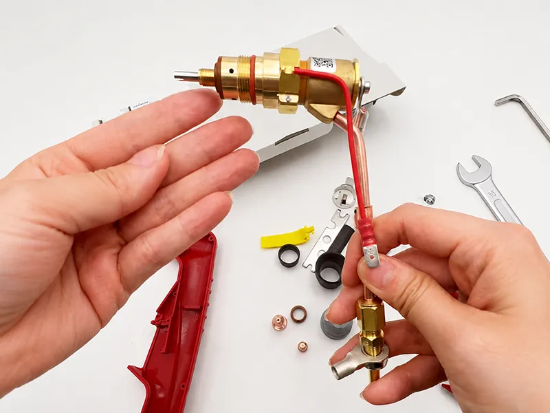 Plasma torch parts assembly with brass fittings and small tools