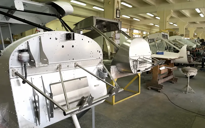 Aircraft structure assembly workshop with lightweight metal airframe components in production