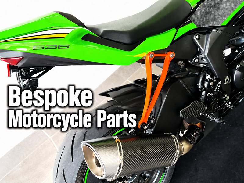 Bespoke Motorcycle Parts with a custom orange mounting bracket on a sport bike