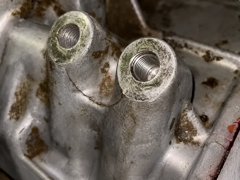 Make Threaded Holes with a tapping tool cutting internal threads in metal