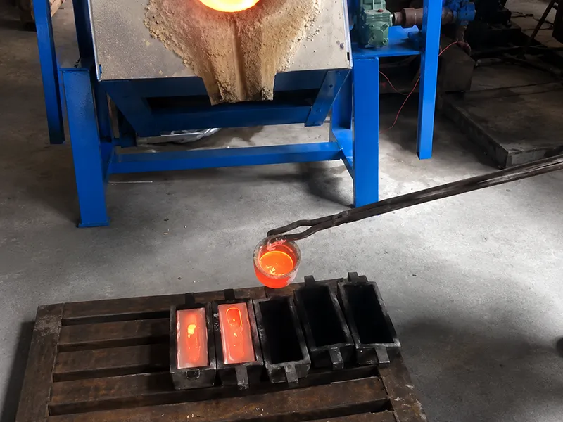 Molten metal being poured into casting molds in an industrial workshop