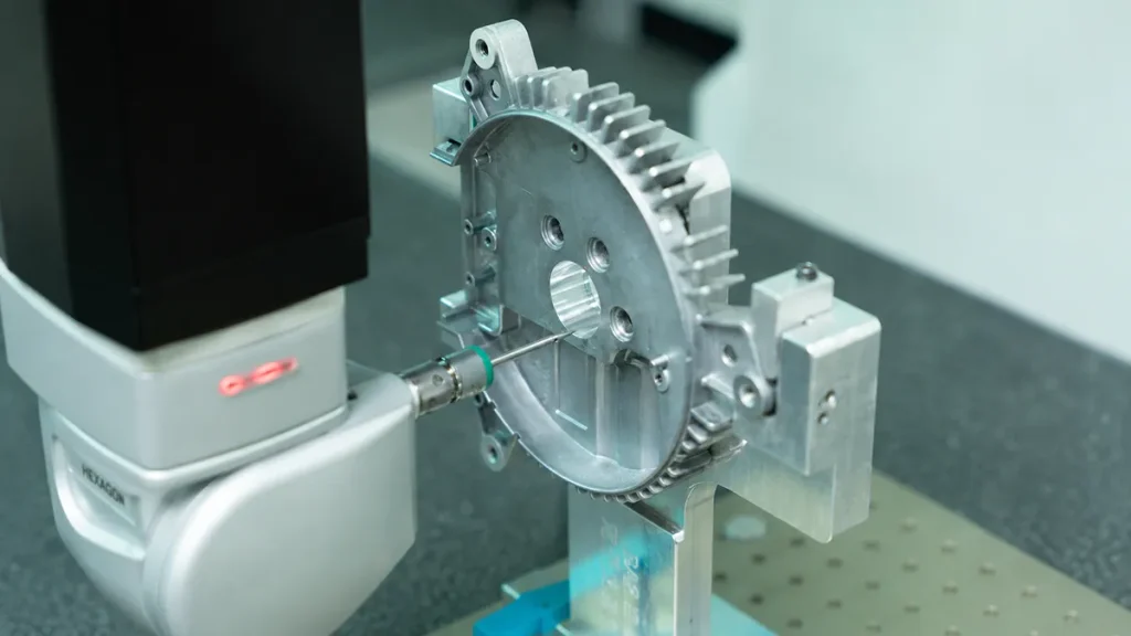 CMM probe inspecting the internal dimensions of a machined metal part