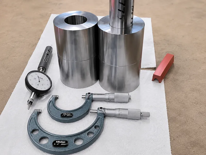 Precision metal shaft and hub components inspected with outside micrometers
