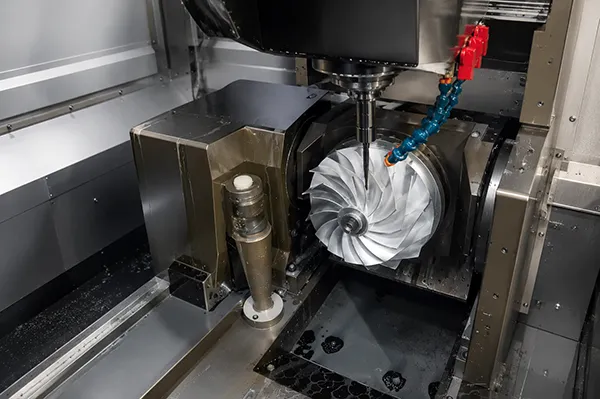 5-axis CNC machining of a precision metal impeller inside a CNC machining center