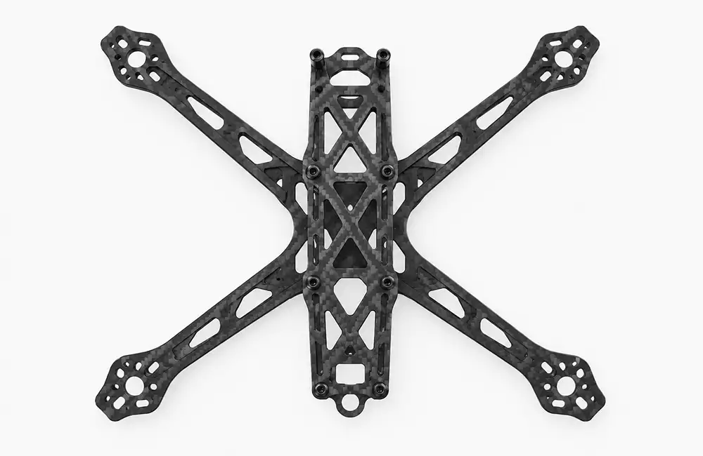 Top view of an X-shaped carbon fiber drone frame with structural cutouts and motor mounting holes on a white background.